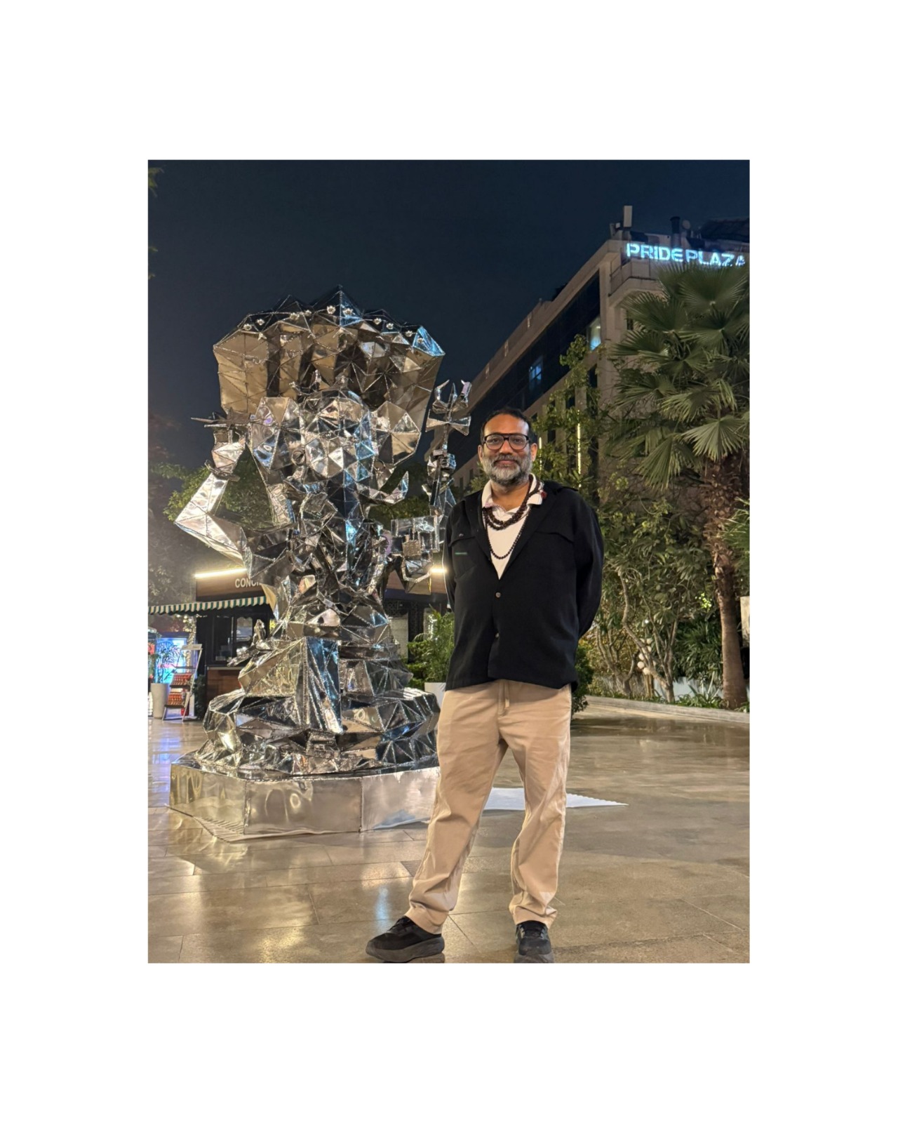 Vikash Kalra beside one of his steel sculptures